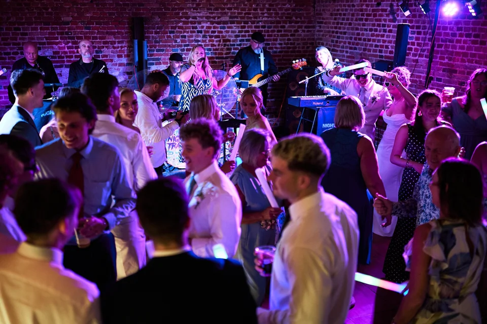 Wedding guests filling the dance floor